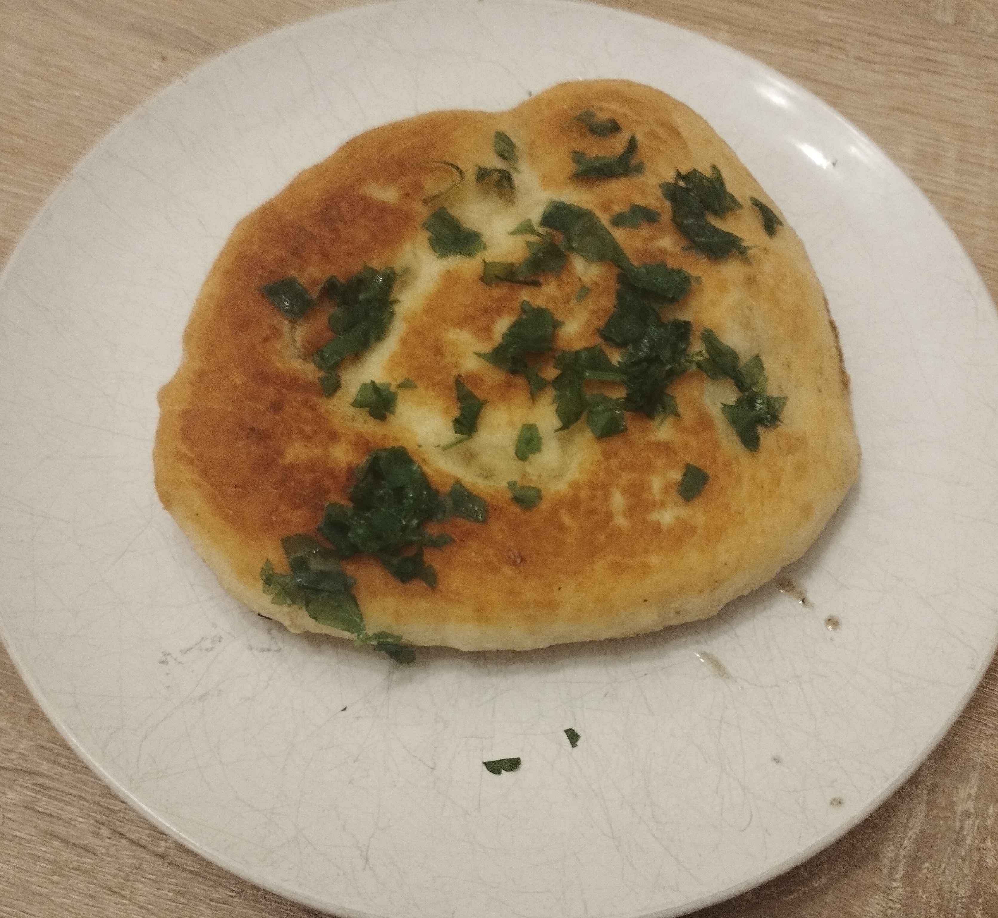 Naan topped with parsley